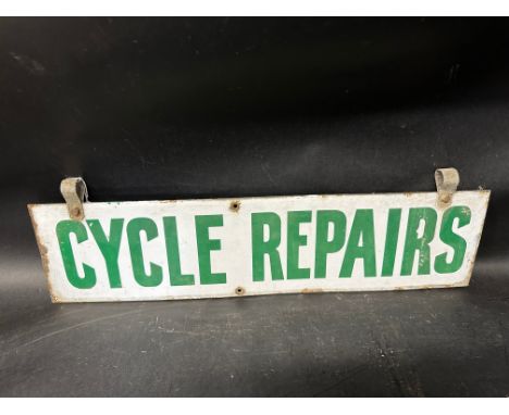 A Cycle Repairs hanging enamel advertising sign, 24 1/4" wide, 6" high excluding attachments, 7 1/4" with. 