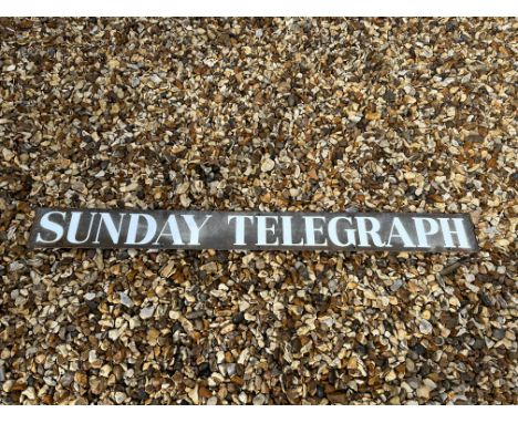 A Sunday Telegraph enamel advertising sign, 42 x 4". 