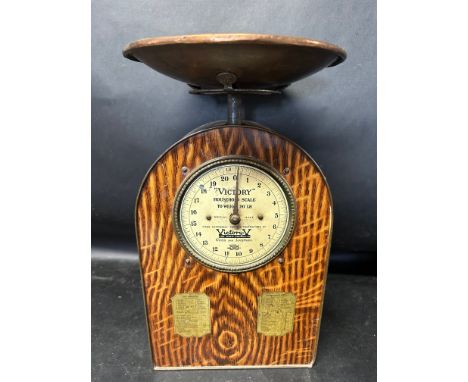 A set of early 20th Century household toleware tin weighing scales advertising Victory V for Cold Journeys - Gums and Lozenge