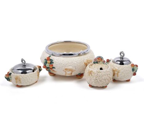 A collection of Clarice Cliff ‘Celtic Harvest’ pattern ceramics, comprising: a fruit bowl, preserve jar, and two sugar bowls,