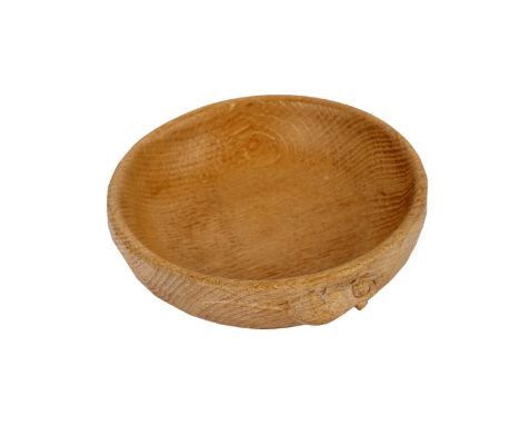 A Robert 'Mouseman' Thompson oak nut bowl, with 'adzed' sides, carved mouse motif, 15.5cms diameter.