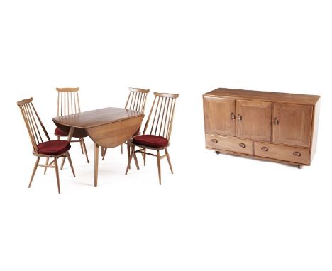 An Ercol elm and beech dining room suite, comprising: Windsor sideboard; four blue label Goldsmith dining chairs and a 'model