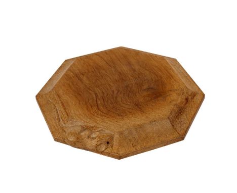 A Robert 'Mouseman' Thompson octagonal oak chopping or cheese board, carved with mouse motif, 20.5cms diameter.
