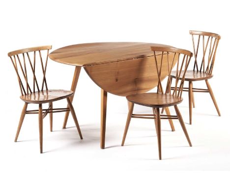 An Ercol elm and beech drop leaf table; and three Ercol ‘Candlestick’ dining chairs, the table 114 x 126 x 72cms. (4)