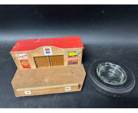 A Dunlop tyre ashtray and a home built wooden toy garage. 