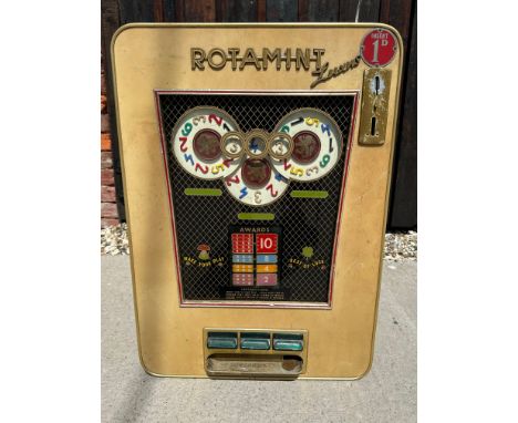 A 1960s German Rotamint Luxus slot machine, 20" wide x 28" tall x 8 1/2" deep.