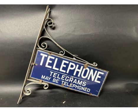 A double sided enamel Telephone sign on bracket 'Telephone. Telegrams May Be Telephoned', 23 x 28 1/2".