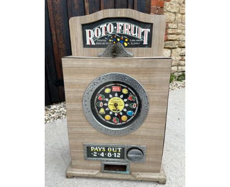 A Roto Fruit slot machine, 19 1/2 x 29 1/2 x 12".