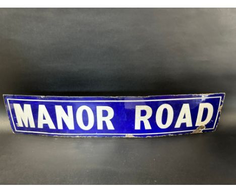 An Edwardian enamel road sign for Manor Road, 34 x 7".