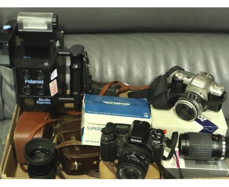 Mixed cameras to include an Olympus Superzoom 700BF, and a Polaroid Studio Express. P&amp;P Group 3 (£25+VAT for the first lo