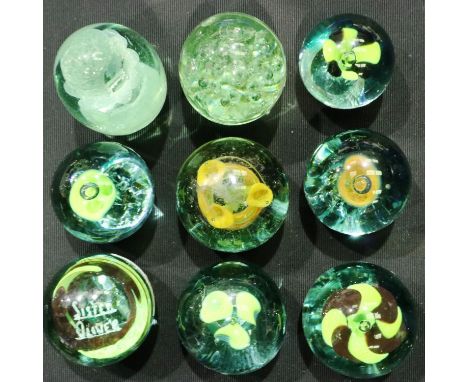 Nine Victorian paperweights with floral inclusions, largest H: 10 cm, scratches to some. P&amp;P Group 2 (£18+VAT for the fir