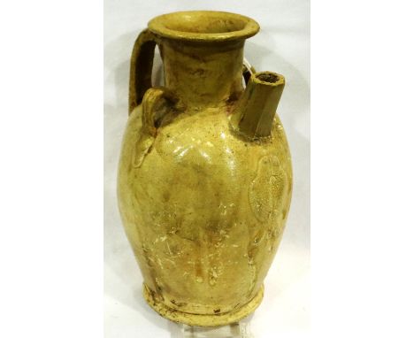 A Ming dynasty glazed ewer, having applied fish design to the body, flared rim and octagonal spout, large single handle and t