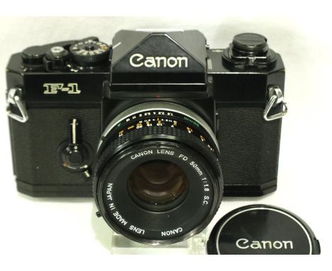 Canon F1 camera with a Canon FD 50mm 1:1.8 SC lens, working at lotting. No scratches or mould to lens, minor wear to camera. 