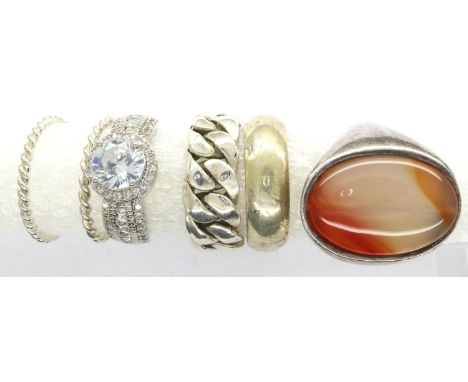 Six mixed 925 silver rings, mixed sizes, one set with a large panel of agate. P&amp;P Group 1 (£14+VAT for the first lot and 