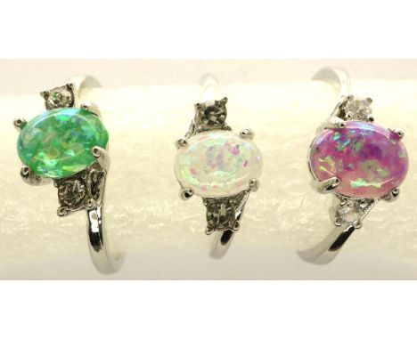 Three opalescent stone set silver rings, sizes P-S. P&amp;P Group 1 (£14+VAT for the first lot and £1+VAT for subsequent lots