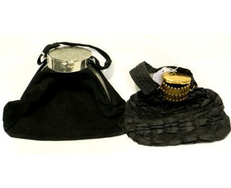 Two black 1950s-1960s evening bags, one velvet with silver coloured engraved metal top and one ruched silk with gold coloured