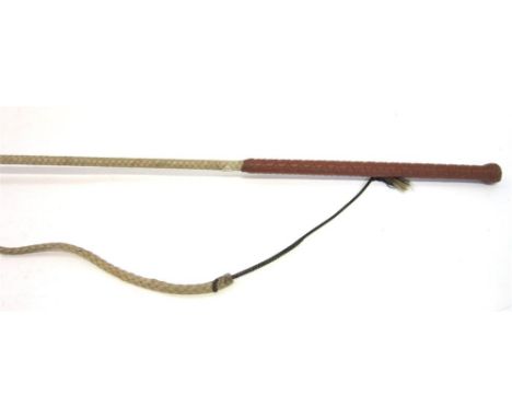 A DRIVING/LUNGING WHIP with plaited leather grip