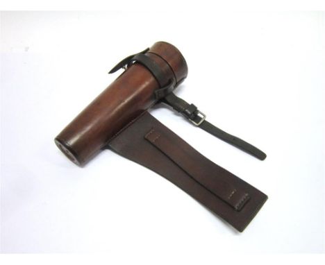 AN EARLY LEATHER FLASK HOLDER with straps for saddle mounting, 20cm