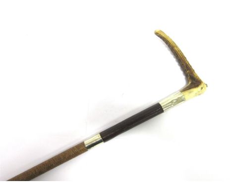A GENT'S HUNTING WHIP with a horn grip, double plated collars, engraved 'Merle & Co', part leather and part plaited shaft