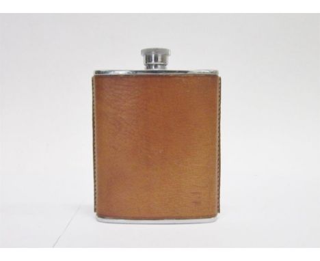 A LEATHER COVERED HIP FLASK