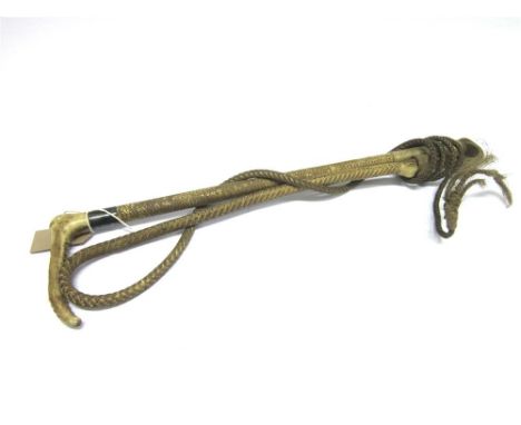 A GENTS HUNTING WHIP with horn grip, the silver collar marked 'Whippy Saddler London' and with plaited shaft