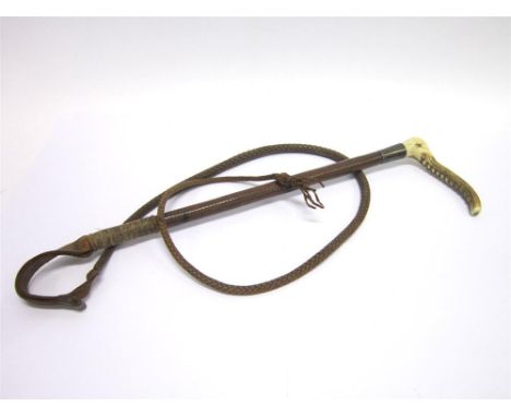 A GENT'S HUNTING WHIP with horn grip, silver collar and plaited leather shaft