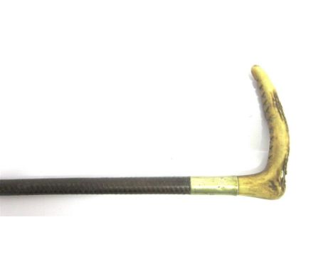 A CHILD'S HUNTING WHIP with horn grip, plated collar engraved with initials 'A.S.' and leather plaited shaft
