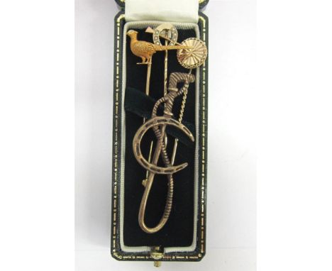 FOUR ASSORTED STICK PINS Including a 9ct horseshoe set with pearls, and an 18ct pheasant 