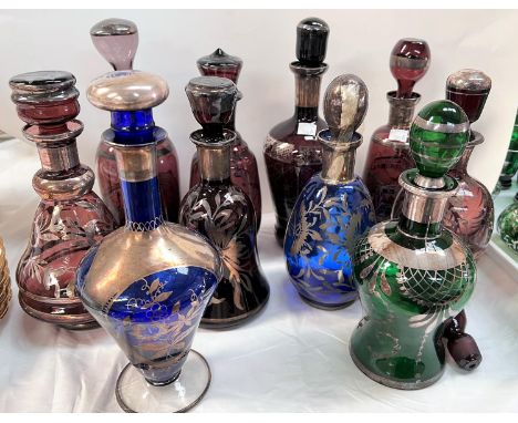 A Venetian glass liqueur decanter of varying colours with silvered decoration 