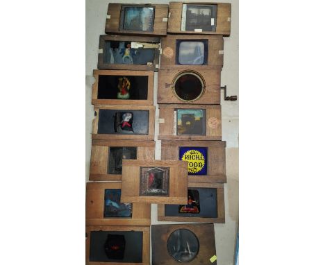 A selection of mahogany framed magic lantern slides:&nbsp; slipping and ratchet, several hand painted 