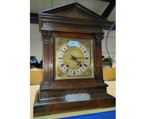 A chiming mantel clock in architectural oak case, silver presentation plate, 1908 