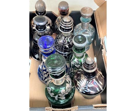 A Venetian glass liqueur decanter of varying colours with silvered decoration 
