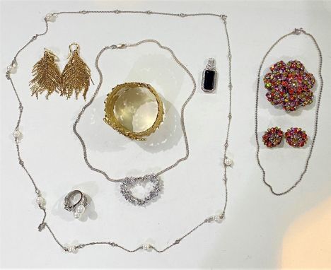 A selection of costume jewellery:&nbsp; a gilt diamante leaf/feather bangle; feather earrings; diamante heart pendants; diama