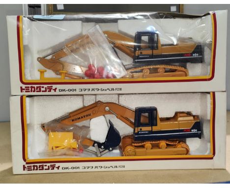 Two boxed Komatsu Tomica Dandy 1/43 scale DK-001 PC200 diecast digger (one plastic front missing) 