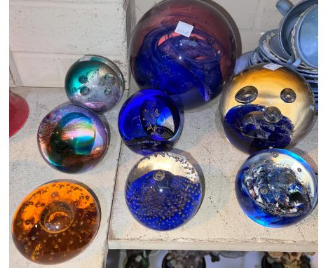 Eight glass paperweights, mostly Caithness, 2 larger size 