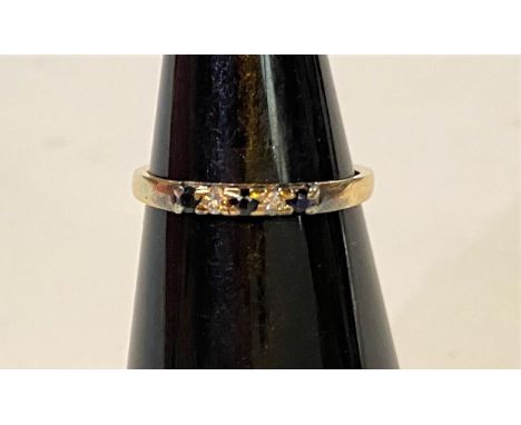 A 9ct hallmarked gold dress ring set with 3 small sapphires and 2 small diamonds, 1.12gm, size K/L 