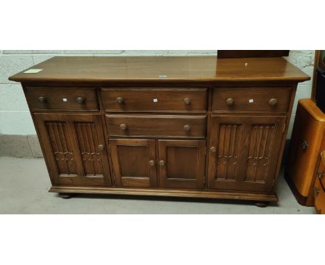 A modern light wood Ercol sideboard height 90cm x width 155 x depth 51cm with fitted cutlery drawer and 3 others, 3 cupboards