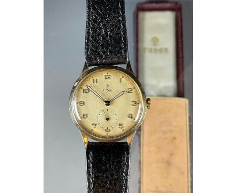 Tudor Rolex - a 1950s 9ct gold cased wristwatch, 31mm diameter case, with textured dial, Arabic numerals, minute track, subsi