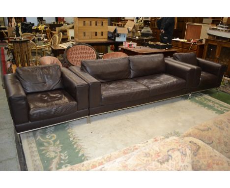 A leather three-piece suite, comprising a three seat sofa and two single armchairs (3)