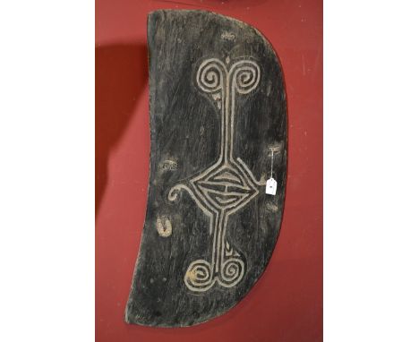 Tribal Art - a Papua New Guinea war shield, carved with lozenge and scroll motifs, 88cm high, 45cm wide, Wapi tribe, Sepik Ri