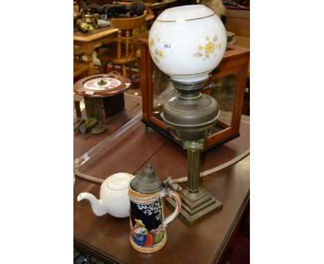 An Edwardian oil lamp; a German stein; a teapot