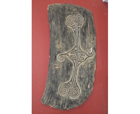 Tribal Art - a Papua New Guinea war shield, carved with lozenge and scroll motifs, 101cm high, 49cm wide, Wapi tribe, Sepik R