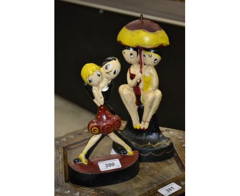 Two cast Art Deco style doorstops 