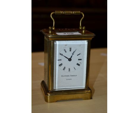 A Matthew Norman of London brass cased carriage clock.
