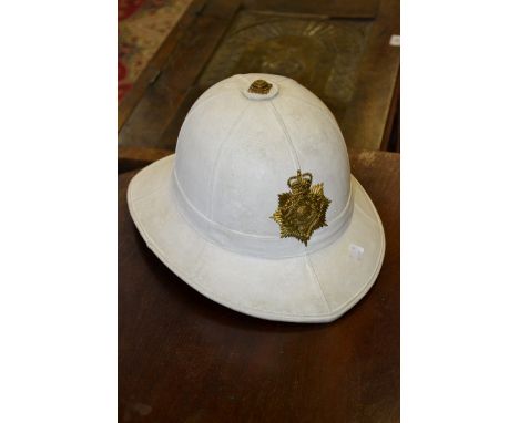 Militaria - a Royal Marines White dress helmet, with regimental badge, with leather liner