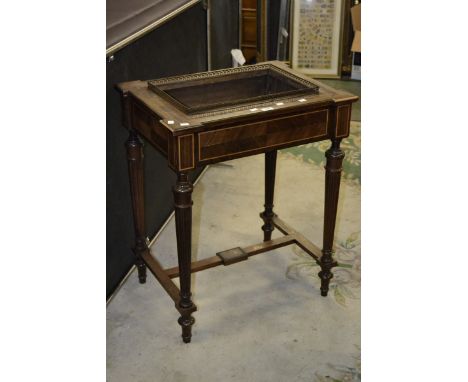 A kingwood planter, pierced brass gallery, herring bone banding, quarter veneered frieze, tapering fluted supports, boxwood s