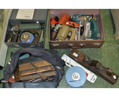 A boxed case with jig saw, drill, saw, angle grinder, boxed and joinery tool in a bag