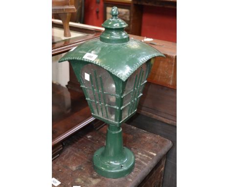 An electric garden lamp, painted green