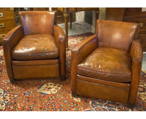 CLUB ARMCHAIRS, a pair, mid 20th century French hand finished vintage brown leather, of compact proportions each with rounded