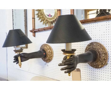 WALL SCONCES, a pair, Empire style ebonised and gilded, each in the form a hand holding a light, 39cm H x 50cm D. (2)